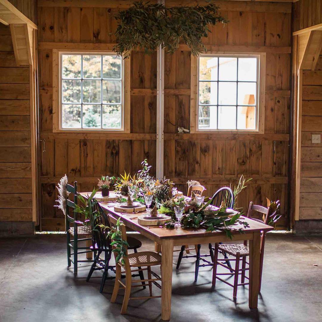 {barn bling}
photo | @abphotonh 
#lockefallsfarm #barnwedding #photoshoot #tablescape #rustic #greenerychandelier #woodchargers #woodland #weddingflorist #lotusfloraldesigns #lakesregionbride