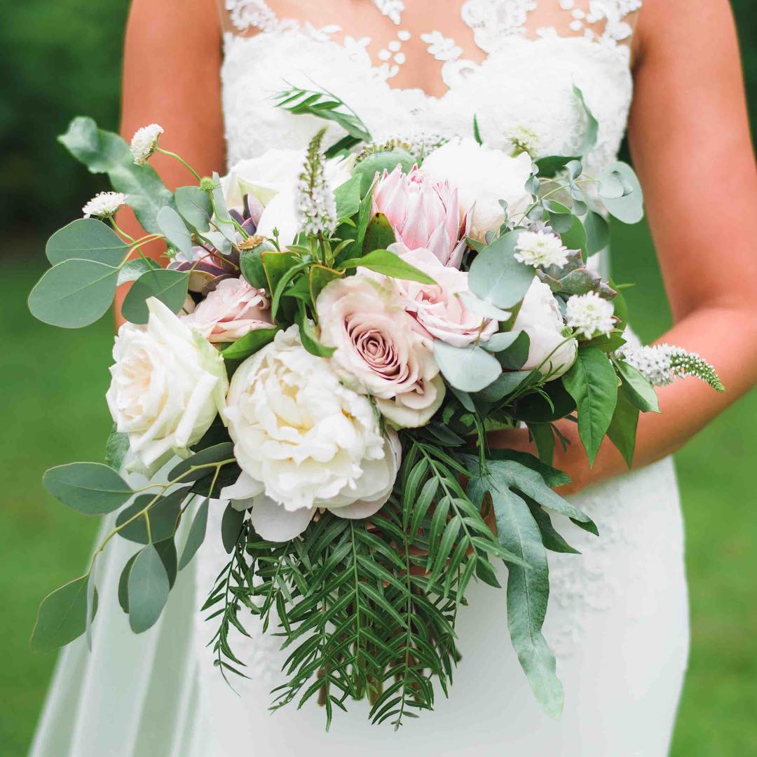 {loveliness}
photo | @callanphoto 
www.callanphoto.com

#bridebling #bouquet #romantic #whimsical #blush #protea #peony #roses #greenery #thatdress #lotusfloraldesigns #weddingflorist